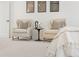 Sitting area in bedroom with two armchairs, decorative pillows, side table at 2718 Byess Ct, Marietta, GA 30064