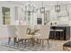 Bright dining area with modern chandelier, a glass-top table and seating for six at 2718 Byess Ct, Marietta, GA 30064