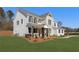 Charming two-story home with a mix of brick and siding, a well-manicured lawn, and inviting front porch at 2718 Byess Ct, Marietta, GA 30064