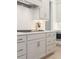 Modern kitchen with gas cooktop, light gray cabinetry and stainless steel accents at 2718 Byess Ct, Marietta, GA 30064