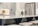 Large kitchen island with a quartz countertop, bar seating, and stainless steel appliances at 2718 Byess Ct, Marietta, GA 30064