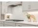 Elegant kitchen with sleek gray cabinets, modern appliances, and a stylish backsplash at 2718 Byess Ct, Marietta, GA 30064