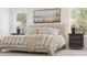 Bright main bedroom featuring a large bed, decorative pillows, and natural light at 2718 Byess Ct, Marietta, GA 30064
