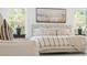 Bright main bedroom featuring a large bed, decorative pillows, and natural light at 2718 Byess Ct, Marietta, GA 30064