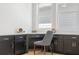Stylish home office with dark cabinets, modern chair, and ample natural light at 2718 Byess Ct, Marietta, GA 30064
