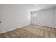 Cozy bedroom with neutral carpet, light walls, and ample natural light from the window at 258 Orwell Dr, Social Circle, GA 30025