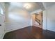 Elegant entryway featuring hardwood floors, decorative moldings, and a view of the staircase at 10 Edgewater Ct, Covington, GA 30016