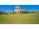 Charming two-story home with a well-manicured lawn and traditional architectural details at 10 Edgewater Ct, Covington, GA 30016