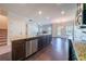 Modern kitchen with granite countertops, stainless steel appliances, and an open layout at 10 Edgewater Ct, Covington, GA 30016
