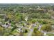 Aerial view of the property surrounded by lush greenery in a quiet, residential neighborhood at 106 Thornwood Dr, Woodstock, GA 30188