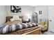 Bedroom with a cozy chair, warm tones, wood-look flooring, and a guitar at 106 Thornwood Dr, Woodstock, GA 30188