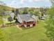 Aerial view of a well-maintained home featuring a fenced yard and a covered patio at 106 Thornwood Dr, Woodstock, GA 30188