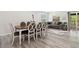 Living room and dining area with hardwood floors and a sectional sofa at 106 Thornwood Dr, Woodstock, GA 30188