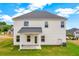 The home's backyard features a covered patio and lush green grass at 319 Overlook Rd, Covington, GA 30014