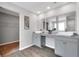 Modern bathroom with double vanity, sleek mirrors, and wood-look flooring at 319 Overlook Rd, Covington, GA 30014