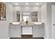 Bright bathroom with dual sinks, granite countertops, and modern fixtures at 319 Overlook Rd, Covington, GA 30014