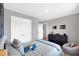 Charming bedroom with plush bedding, a dresser, and a cozy beanbag chair at 319 Overlook Rd, Covington, GA 30014