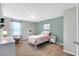 Bright bedroom features a twin bed, a white dresser, and charming decor at 319 Overlook Rd, Covington, GA 30014