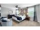 Spacious bedroom with neutral tones, a ceiling fan, and ample natural light at 319 Overlook Rd, Covington, GA 30014