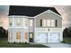Charming two-story home featuring a brick facade, attached two-car garage and classic architectural design at 319 Overlook Rd, Covington, GA 30014