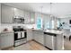 Beautiful kitchen with stainless steel appliances and eat in dining, perfect for modern living at 319 Overlook Rd, Covington, GA 30014