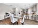 Dining area with modern kitchen featuring stainless steel appliances, and stylish wooden bar stools at 319 Overlook Rd, Covington, GA 30014