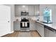 Well-equipped kitchen featuring stainless steel appliances, granite countertops, and ample storage space at 319 Overlook Rd, Covington, GA 30014