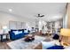 Spacious living area with open floor plan, featuring stylish furniture, dining area, and kitchen at 319 Overlook Rd, Covington, GA 30014