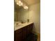 Bathroom featuring a double vanity sink, large mirror, and ample lighting at 3627 Mcclaren Way, Lawrenceville, GA 30044