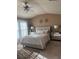 Bedroom with a plush bed, mirrored nightstands, and a ceiling fan at 3627 Mcclaren Way, Lawrenceville, GA 30044