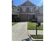 Charming two-story home with a well-maintained front yard, garage, and mailbox with visible address at 3627 Mcclaren Way, Lawrenceville, GA 30044
