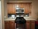 Well-equipped kitchen with stainless steel appliances, ample cabinet space, and modern oven at 3627 Mcclaren Way, Lawrenceville, GA 30044