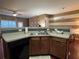 Open kitchen featuring a stainless steel sink and dark wood cabinetry at 3627 Mcclaren Way, Lawrenceville, GA 30044