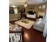 Spacious living area with hardwood floors, a fireplace, and an open layout to the kitchen and breakfast bar at 3627 Mcclaren Way, Lawrenceville, GA 30044