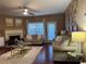 Well-lit living room featuring a fireplace, neutral seating, and a stylish area rug, perfect for relaxation at 3627 Mcclaren Way, Lawrenceville, GA 30044