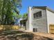 Fenced backyard with mature trees providing shade and privacy at 6213 Marbut Farms Chase, Lithonia, GA 30058