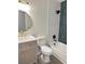 Bathroom featuring modern vanity, white and green textured tile, and shower over tub at 6213 Marbut Farms Chase, Lithonia, GA 30058