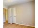 Bedroom featuring laminate floors and a closet with modern doors at 6213 Marbut Farms Chase, Lithonia, GA 30058