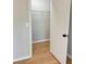 Walk-in closet with a metal shelf and laminate wood flooring at 6213 Marbut Farms Chase, Lithonia, GA 30058