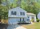 Charming home with a well-maintained exterior, front lawn, and attached garage at 6213 Marbut Farms Chase, Lithonia, GA 30058