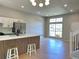 Contemporary kitchen featuring a large island, stainless steel appliances, and stylish pendant lighting at 6213 Marbut Farms Chase, Lithonia, GA 30058