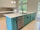 Kitchen island features a stainless steel dishwasher, modern sink, and ample cabinet space at 6213 Marbut Farms Chase, Lithonia, GA 30058