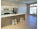 Modern kitchen with large island, stainless steel appliances, and open floor plan at 6213 Marbut Farms Chase, Lithonia, GA 30058