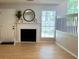 Bright living room boasts a fireplace, natural light, and neutral paint at 6213 Marbut Farms Chase, Lithonia, GA 30058