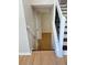 View down staircase shows natural wood flooring and white risers at 6213 Marbut Farms Chase, Lithonia, GA 30058