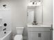 Bathroom with a single sink vanity and shower and bathtub combo at 920 Melody Ridge Ln, Buford, GA 30518