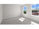 Bedroom featuring two windows providing natural light and a view of the outdoors at 920 Melody Ridge Ln, Buford, GA 30518