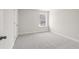 Bedroom with neutral carpet and window with natural light at 920 Melody Ridge Ln, Buford, GA 30518
