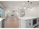 Open-concept kitchen and living area with a fireplace and hardwood floors at 920 Melody Ridge Ln, Buford, GA 30518