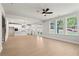 Open-concept living space that connects to the kitchen, with large windows providing lots of natural light at 920 Melody Ridge Ln, Buford, GA 30518